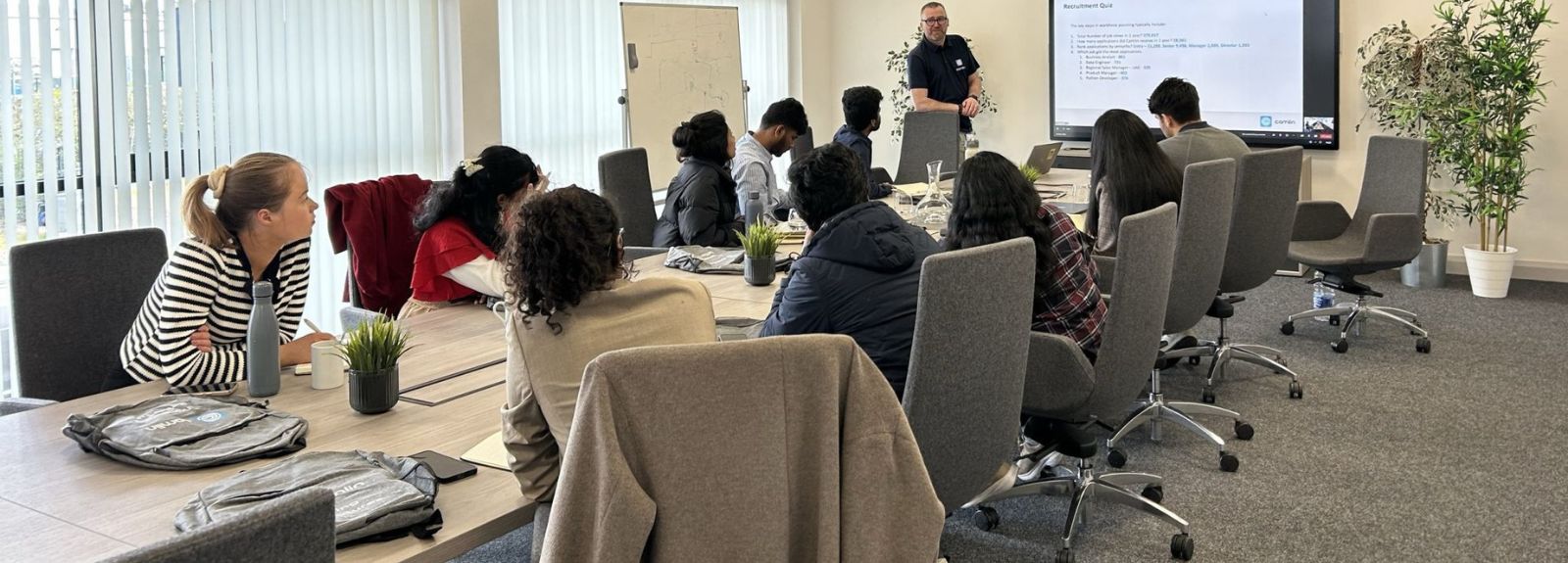 students in a seminar room listening to an employer